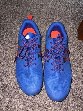 New Balance Blue Running Shoes with Red Accents